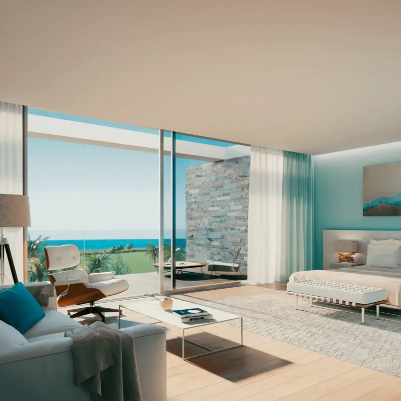 Quarto com parede de pedra, cadeirão de pele e vista aberta para o mar